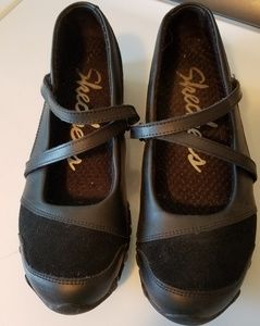 Skechers black slip-on shoes
